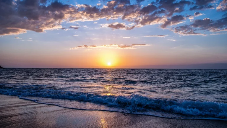 Sunset over the ocean waves on the Mare in Marocco coastline