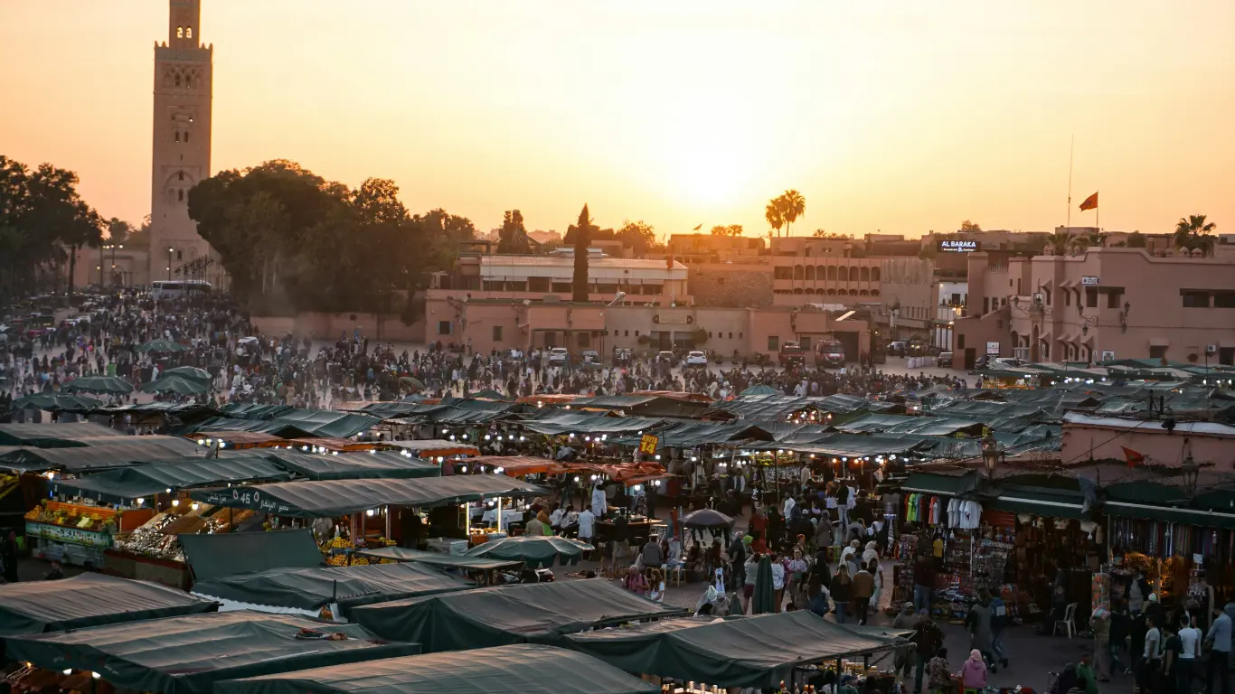 Busy Jemaa el-Fnaa square at sunset in Marrakech, the starting point of a 4 days tour to Merzouga desert