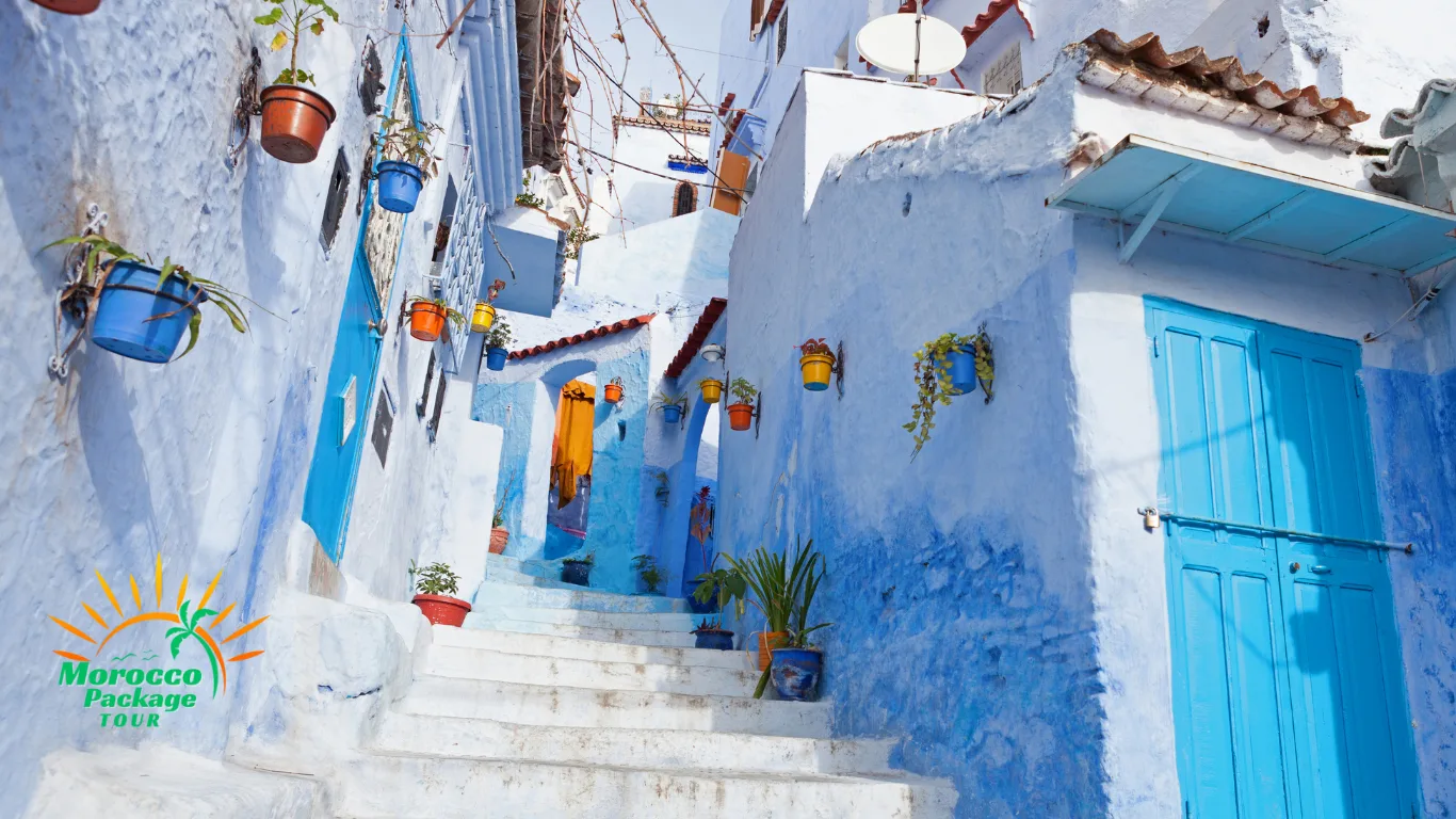 Sunlit blue stairway in Chefchaouen’s medina, a photogenic stop on a 12 days Morocco tour itinerary from Casablanca.