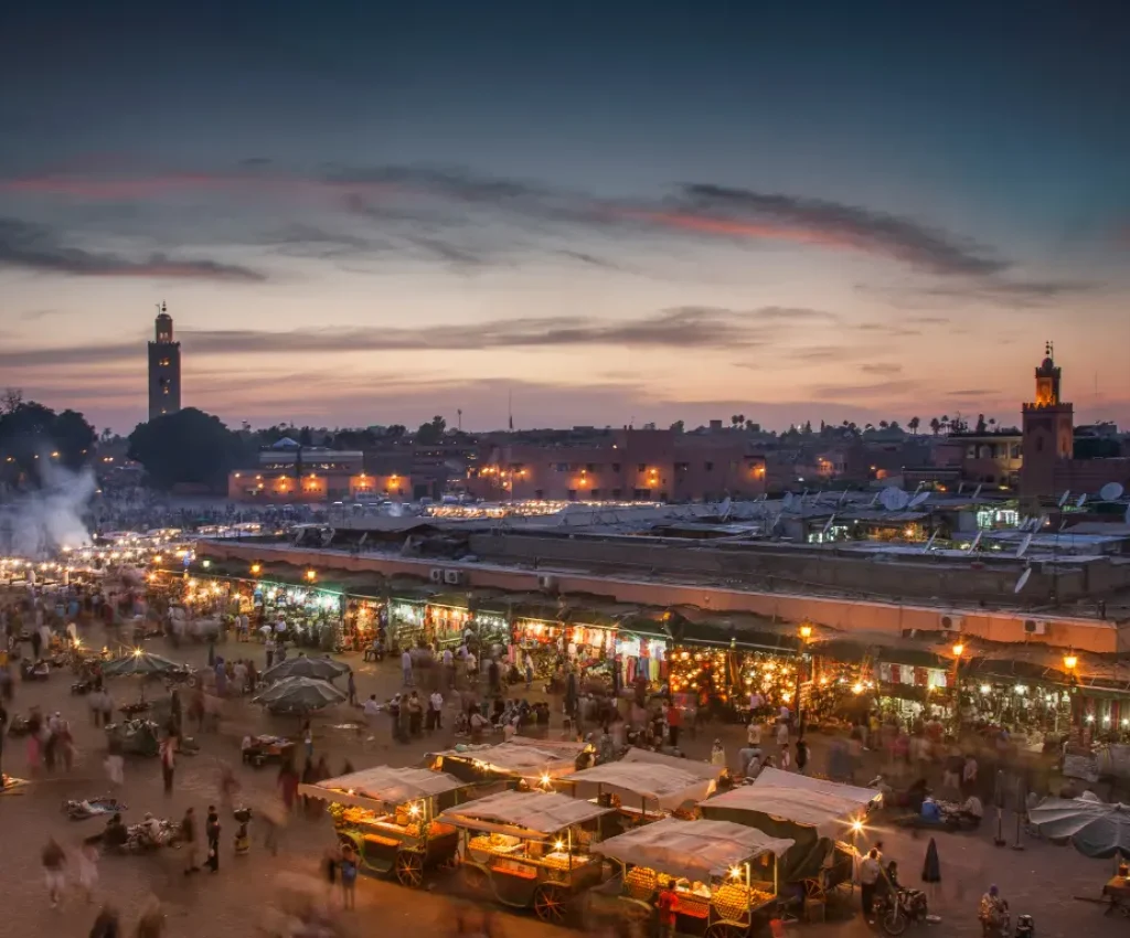Vibrant evening scene at Jemaa el-Fnaa market in Marrakech, the starting point of a 4 day desert tour.