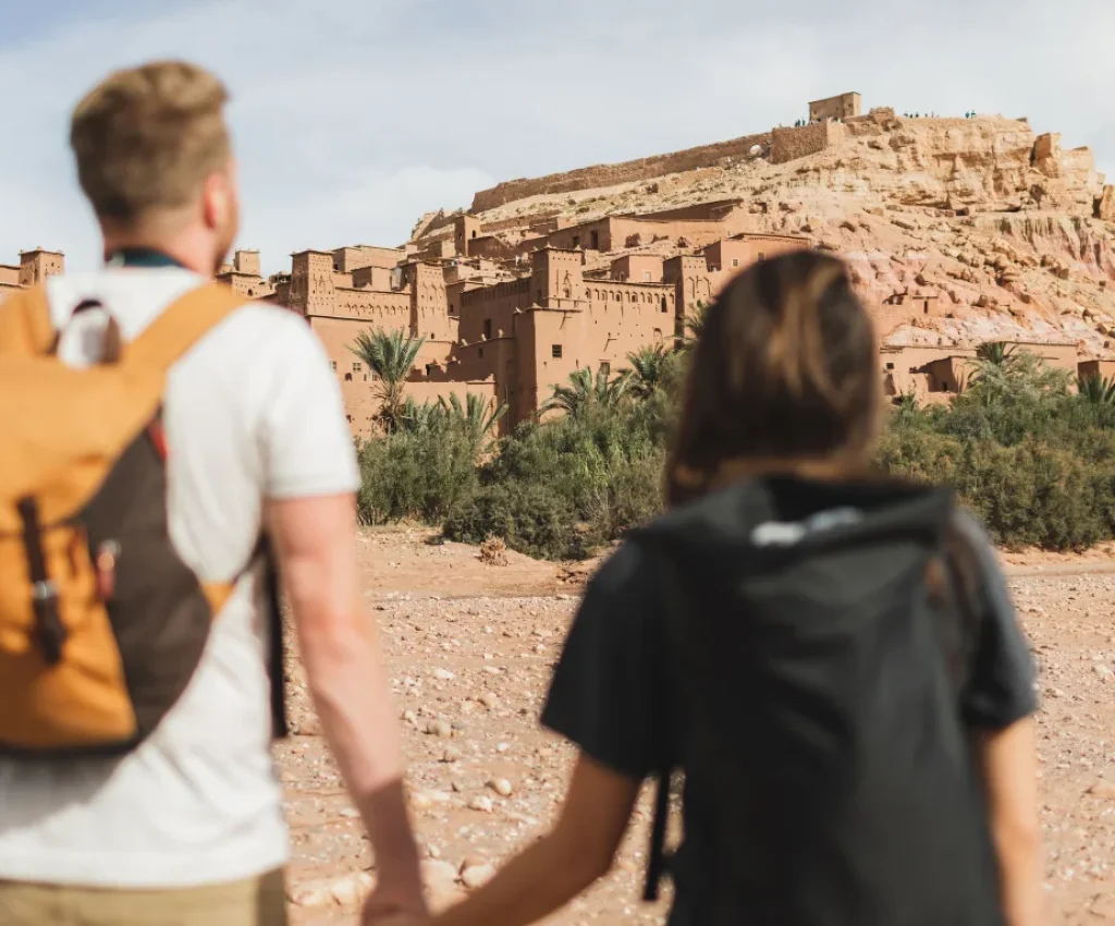 Ait Ben Haddou – A Must-See Stop on Your Morocco 5 Day Itinerary Couple exploring Ait Ben Haddou during a Morocco 5 day itinerary adventure